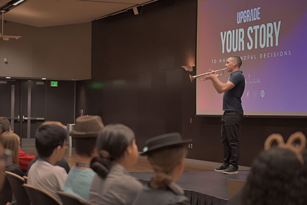 Youth Motivational Speaker Kevin Mecchella playing trumpet for the HOBY AZ seminar