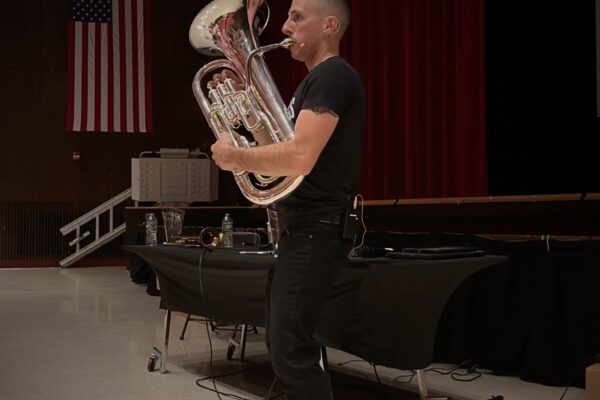 Youth Motivational Speaker Kevin Mecchella playing euphonium at East Islip high school