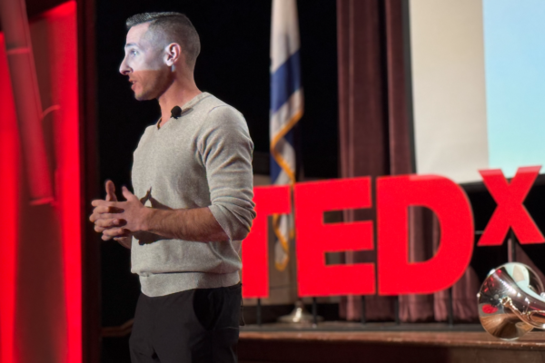 Kevin Mecchella speaking at a TEDx event
