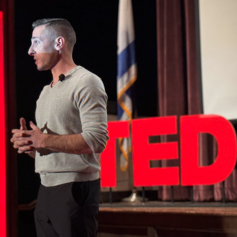 Kevin Mecchella speaking at a TEDx event