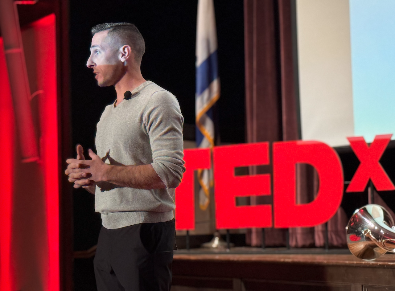 Kevin Mecchella speaking at a TEDx event